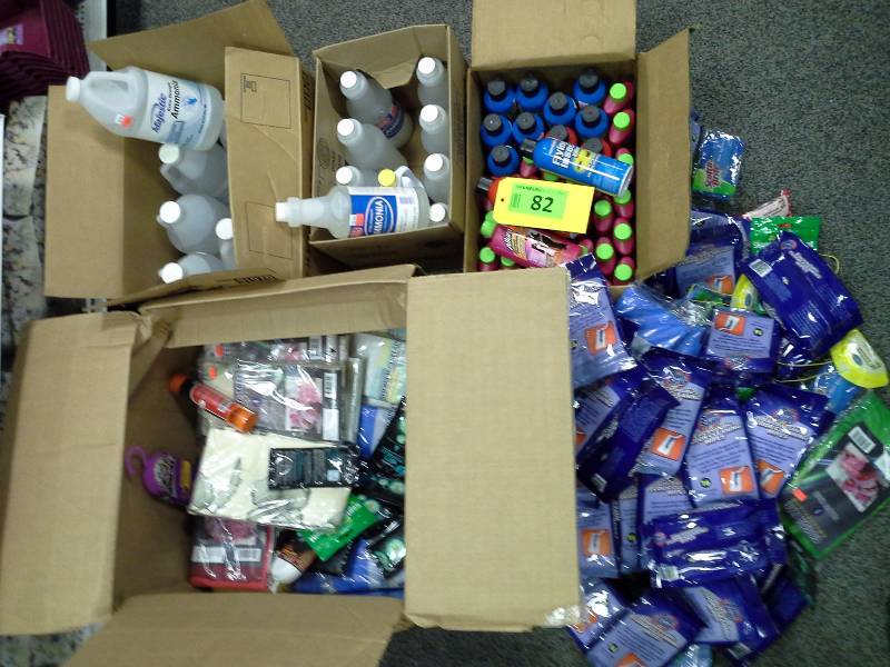 Four boxes of various cleaners, ammonia, wipes, pillowcases and shower curtains