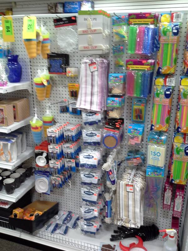 Assortment of household items, batteries, straws