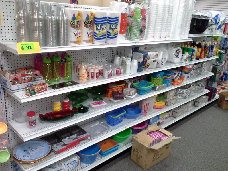 Large assortment of paper towels, cups, disposable plates and cookware
