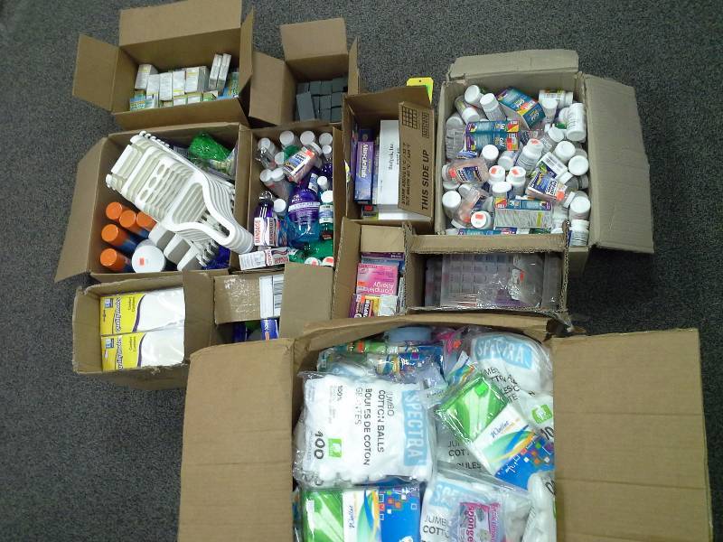 11 boxes of health related items, vitamins and antacids, shower caddies, shoe inserts