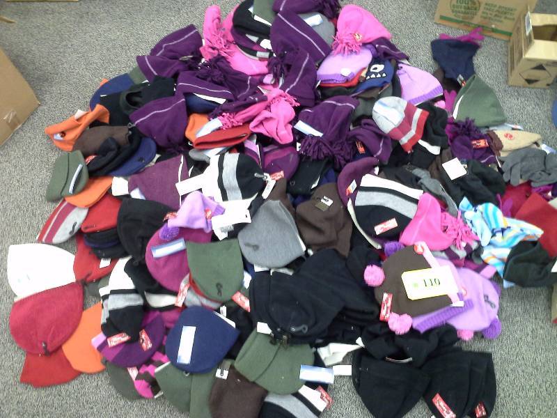 Very large assortment of stocking hats, some gloves