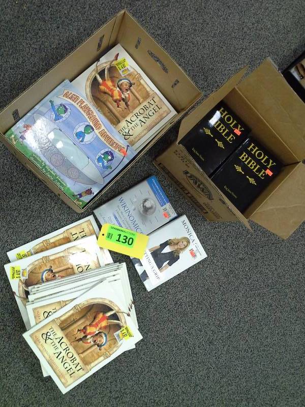 Assortment of new books, the holy Bible