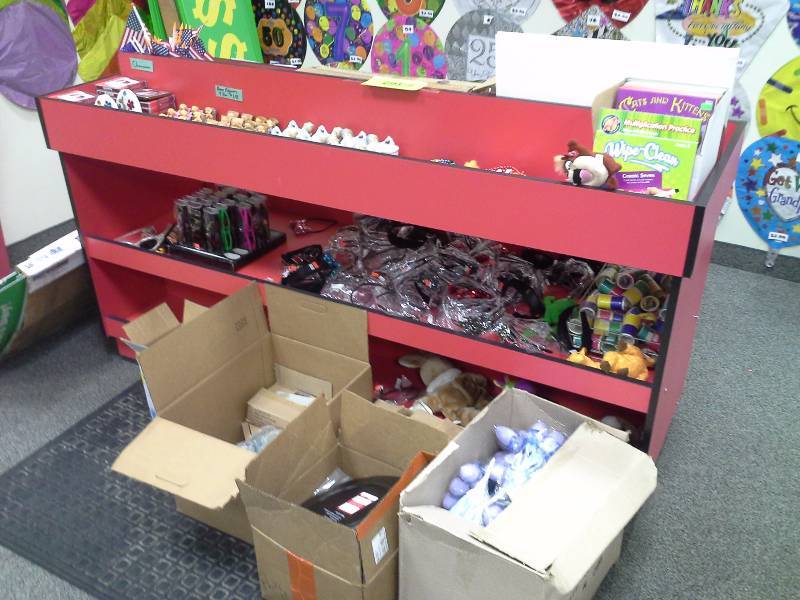 Red display rack and all contents, other boxes of toys.