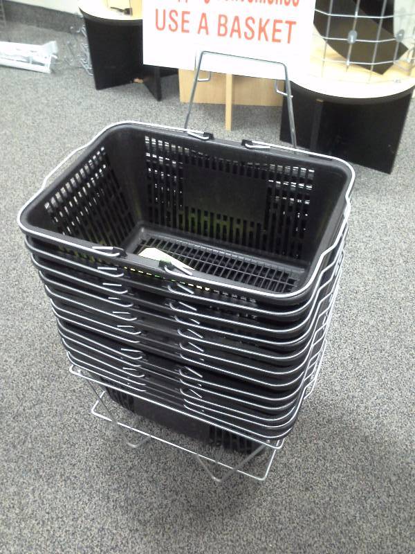 Stack of shopping baskets with stand