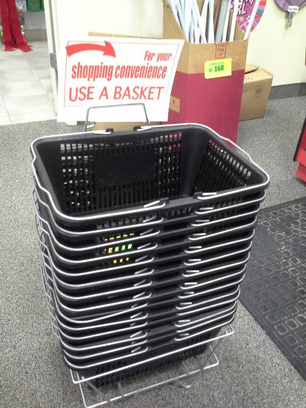Stack of shopping baskets with stand