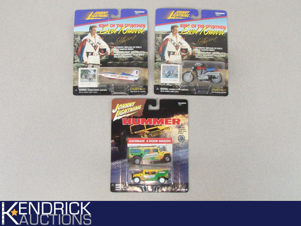 3 Vintage MINT ON CARD Johnny Lightning Evil Knievel, and Hummer Cars