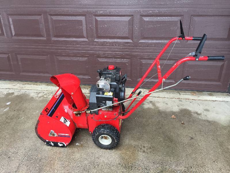 lot 112 image: Quality Troy-Bilt Snowblower 5HP Tecumseh Engine, ElectricPull Start, 3 Forward Speeds & Reverse. See the YouTube