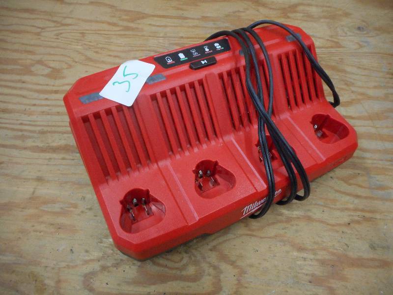 lot 35 image: Milwaukee M12 4-Place Battery Charg...
