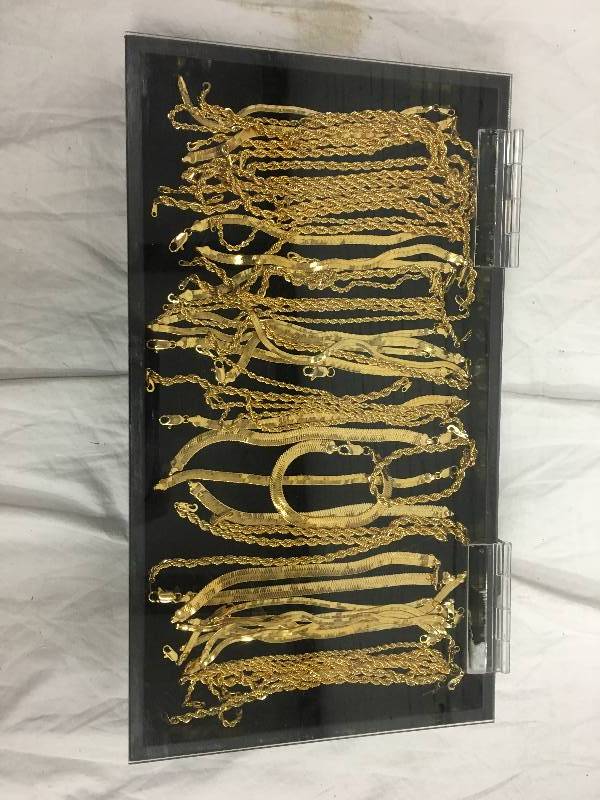 over 50 gold plated chains  comes with display case