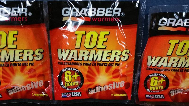 lot 63 image: Group  of (11) Grabber Toe Warmers
