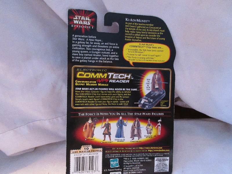 lot 7 image: ki-adi-mundl with light saber