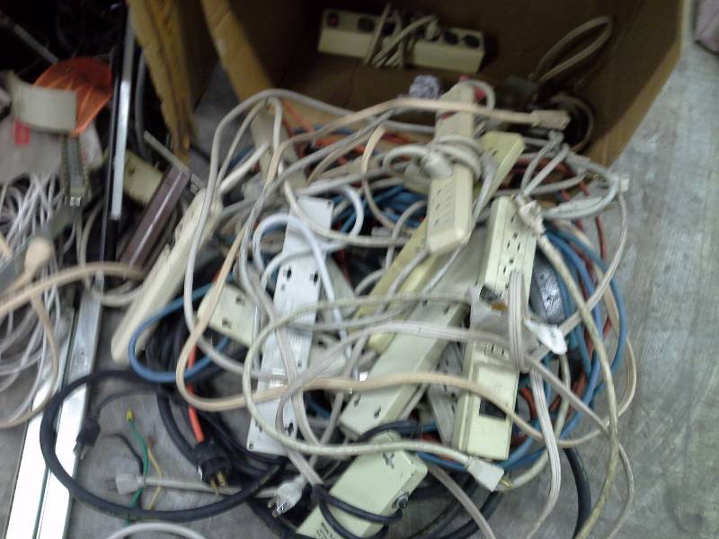 Lot of surge protectors and extension cords.