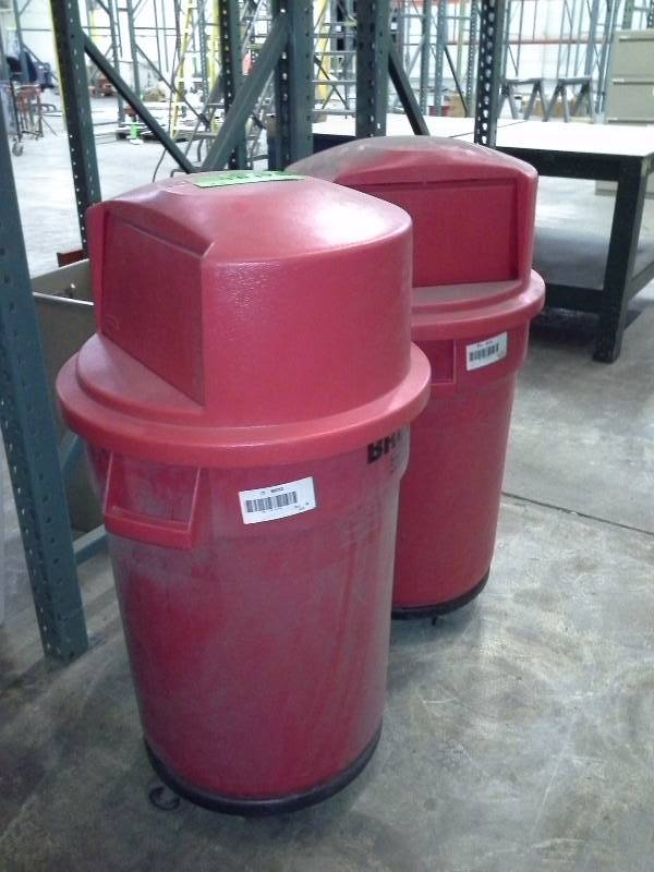 Pair of red trash containers on casters