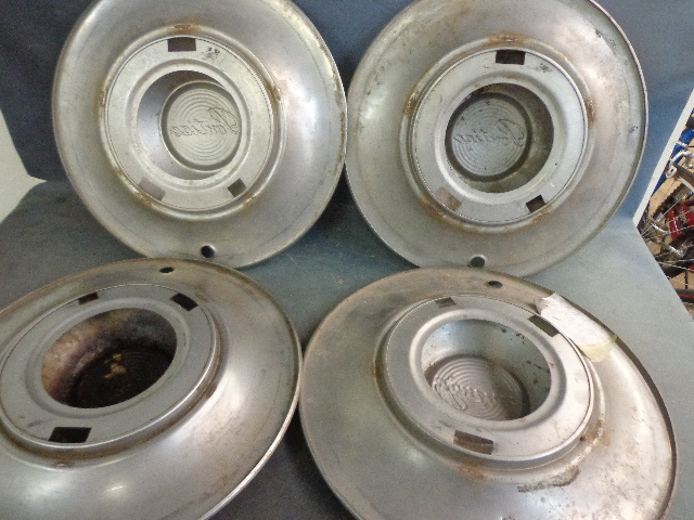 lot 34 image: Chrome Pontiac Hubcaps