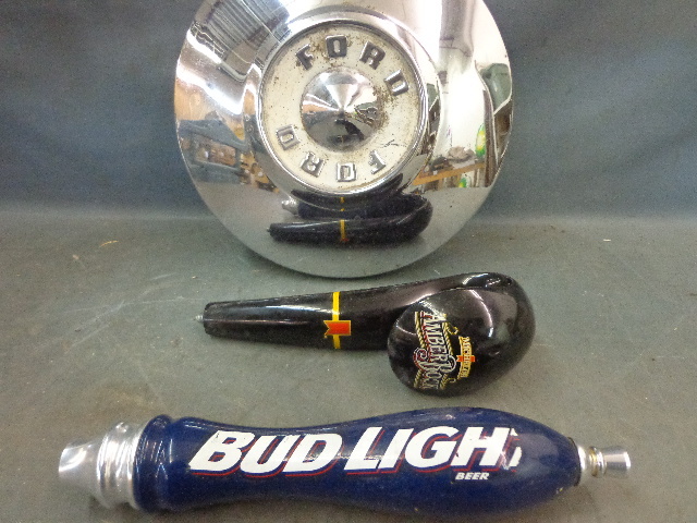 lot 79 image: Beer Taps & Ford Hubcap