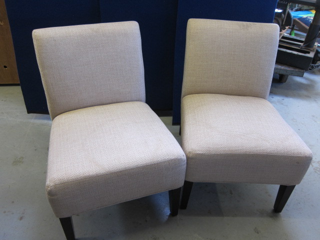 Two Beige with Black Legs Chairs
