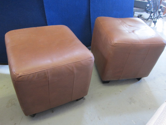 Two medium toned Faux Leather Ottomans