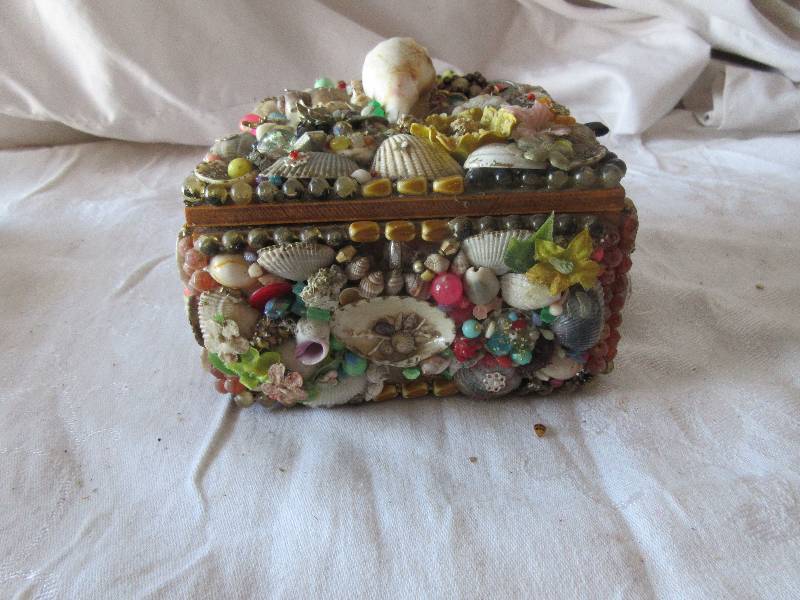 wood en trinket box covered in sea shells