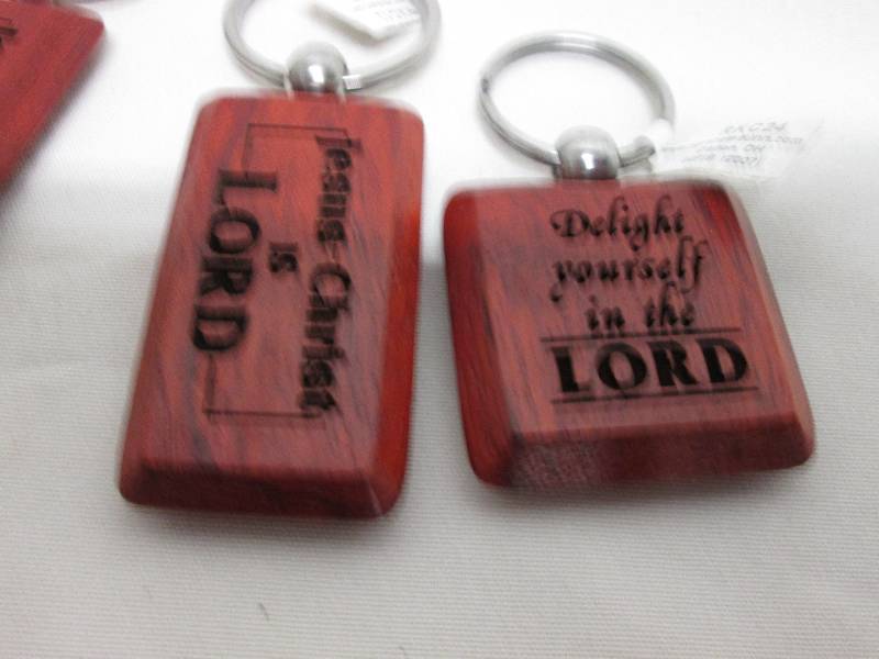 Lot of 7 wooden religious key chain...