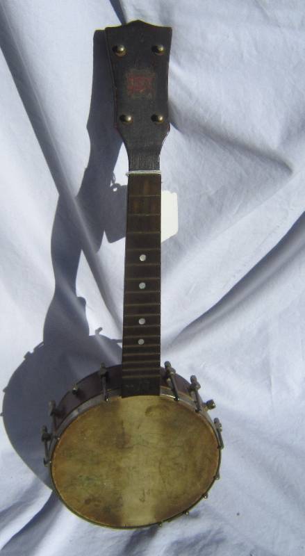 lot 625-COPY image: Vintage Pony Banjo with artistic work on hide.