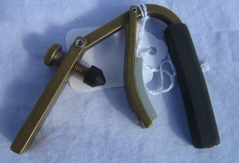 lot 691-COPY image: Gold Shubb Guitar Capo