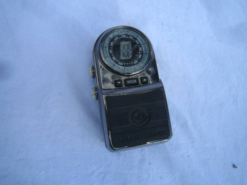 lot 696-COPY image: Planet Waves J.P. Daddario Strobe Guitar Pedal Tuner.