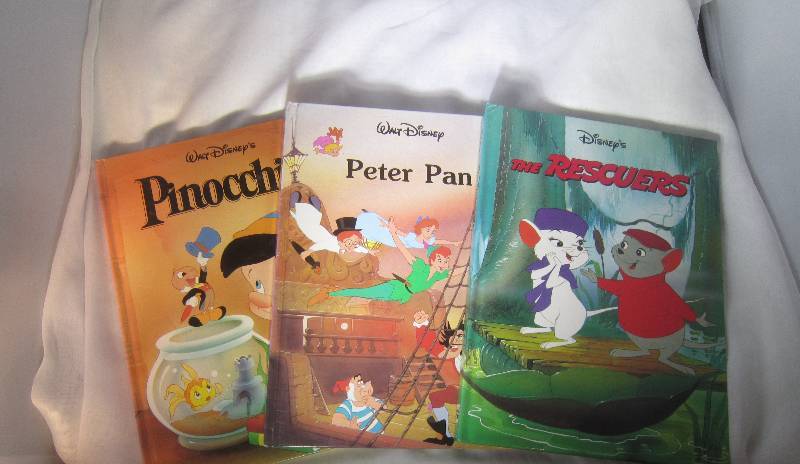 lot 868 image: 3 Disney Books - Pinocchio, Peter Pan & The Rescures