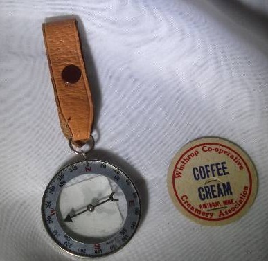 lot 895 image: Unique Compass with Leather Holder & Coffee Cream  Token