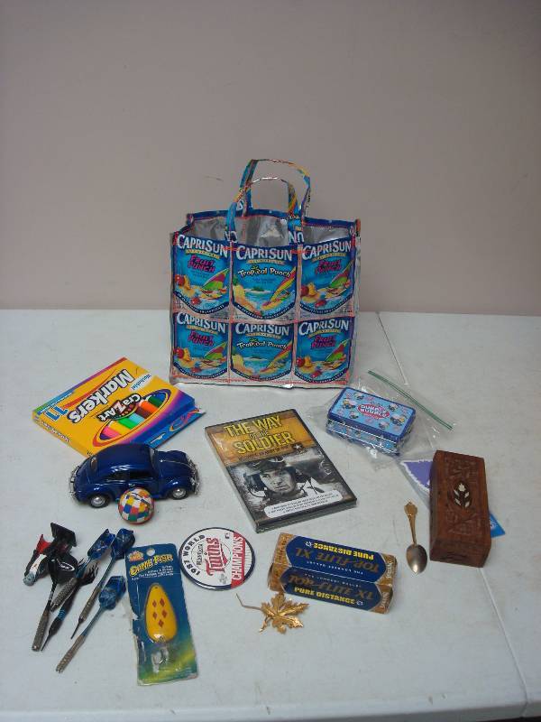 lot 83 image: Capri Sun Bag With Some Small Items