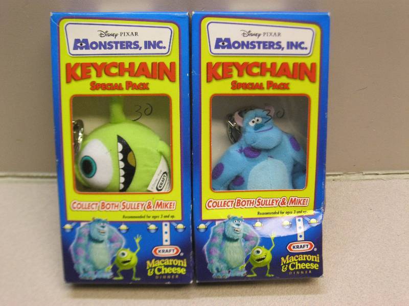 lot 105 image: Two Monsters Inc Mac N Cheese, Keychains