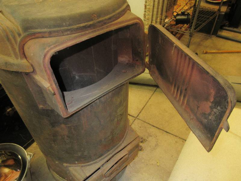 lot 14 image: Vintage Cast Iron Tall Wood Stove