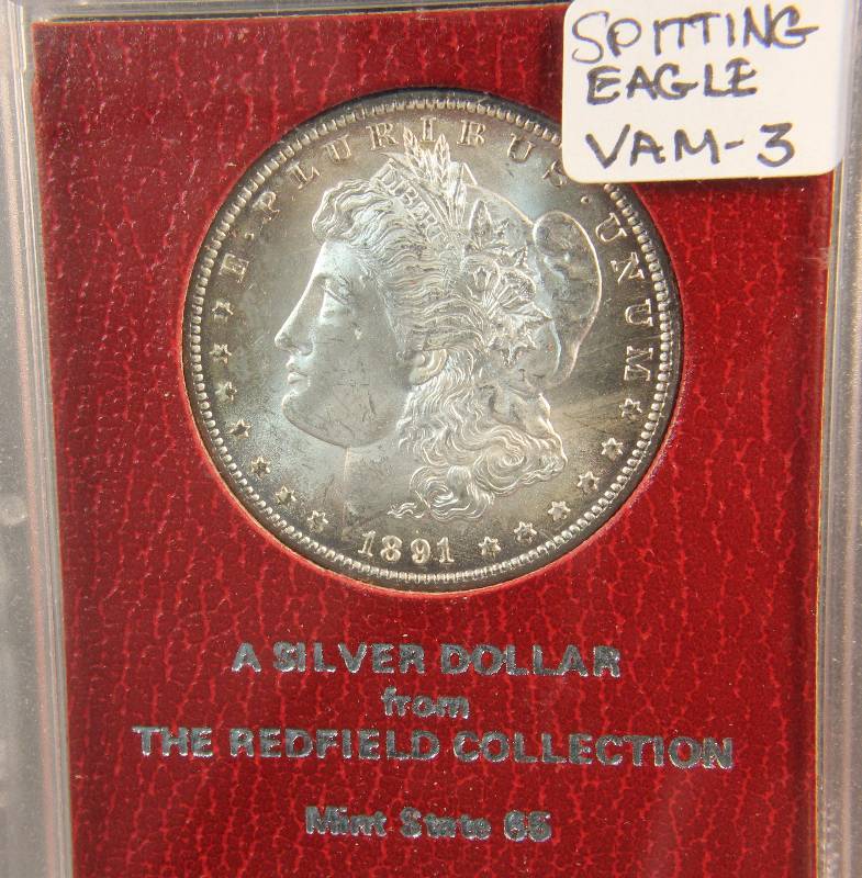 EXTREMELY RARE 1891CC MS65 REDFIELD MORGAN DOLLAR IN ORIGINAL PARAMOUNT RED HOLDER