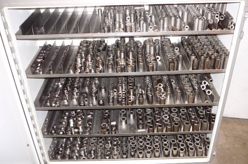 cabinet on caster full of Steel Spacers 36 wide X 12 d X 44 High 5 Shelves with 20 Dividers