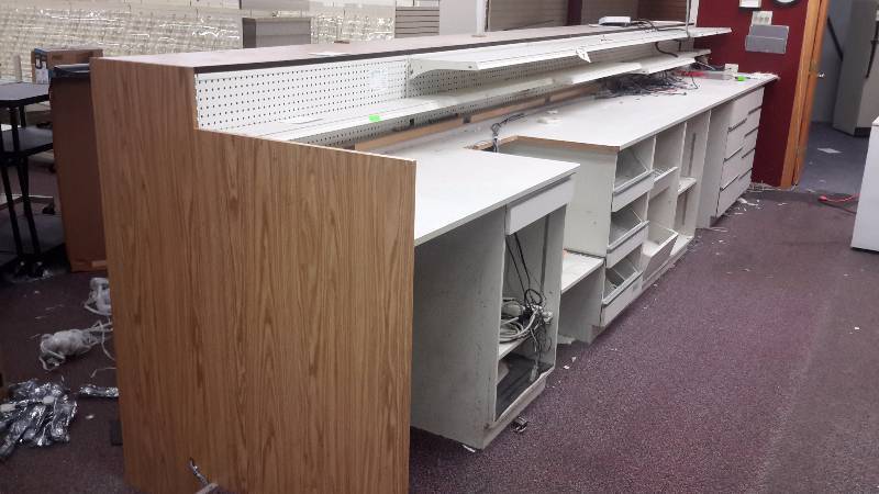 4, 4ft sections of wall display and 24 shelves and back side counter. PLEASE INSPECT to see how this could work for you.