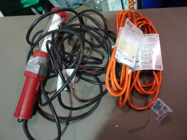 NEW Lot incl Qty 2 NEW 10 ft orange Outdoor Extension Cords and 1 Damaged Trouble Light with 20 ft cord and integrated outlet. Light is broken.