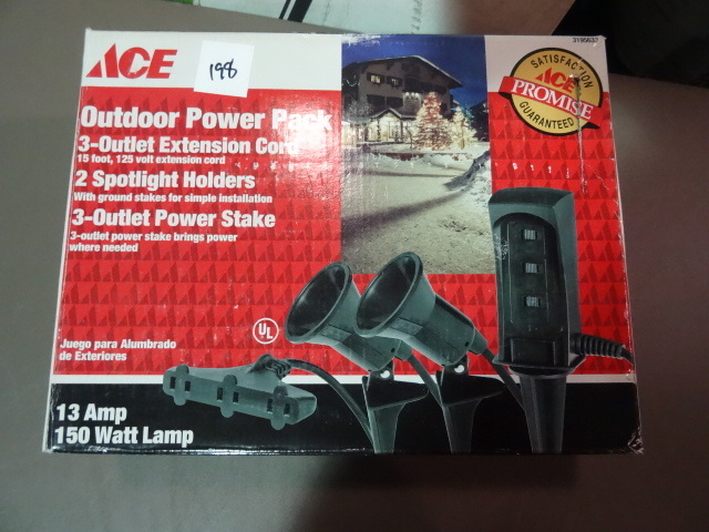 NEW Outdoor Lighting Power Pack incl 15 ft 3 outlet extension cord, 3 outlet power stake and 2 spotlight holders. Labeled as missing screw