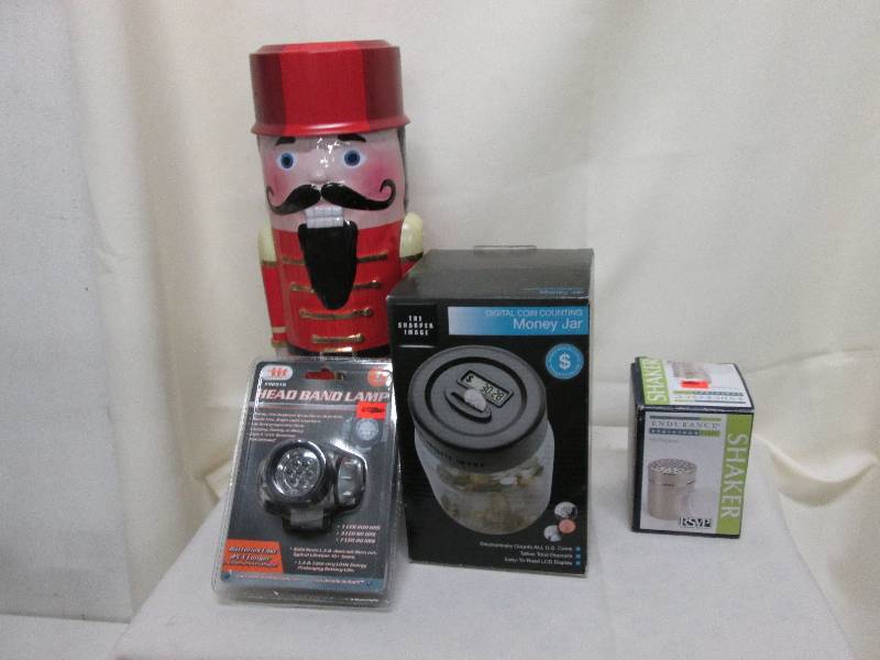 Nutcracker tin, head band lamp, dig...