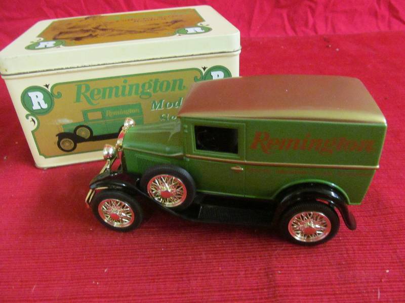lot 169 image: Remingto tin with Sedan coin bank