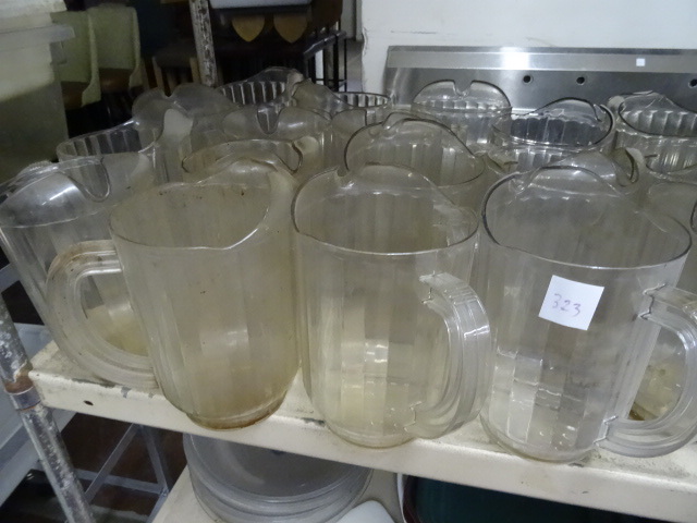 lot 323 image: Shelf Full of Water Pitchers