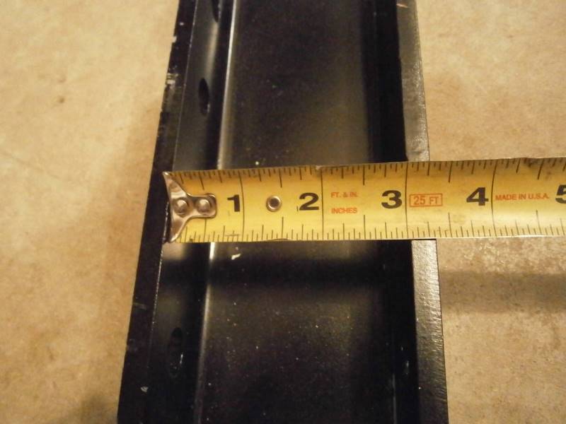Adjustable weld on hitch plate