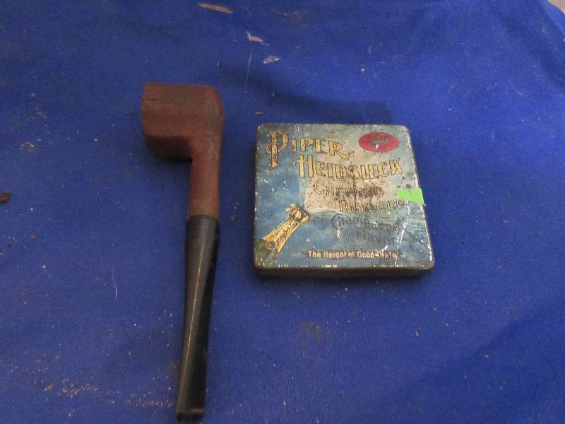 collectible pipe and tin