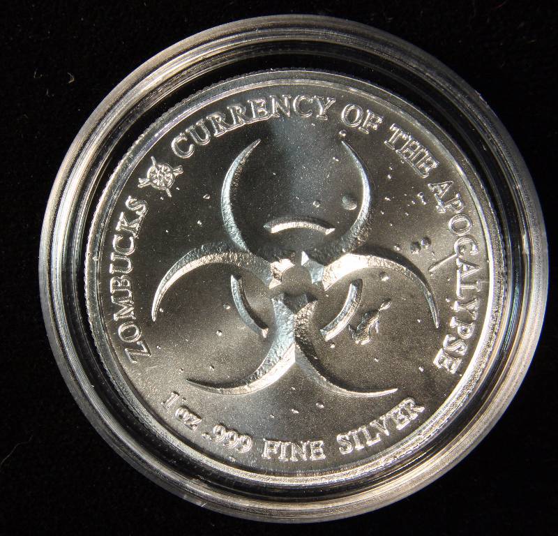 1 TROY OZ. .999 FINE SILVER ZOMBUCKS THE SAINT APOCALYPSE ROUND IN AIRTITE HOLDER