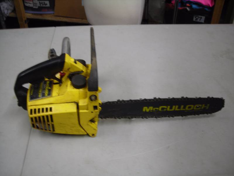 lot 4 image: McCulloch 14 Inch Gas Chain Saw Has Compression.