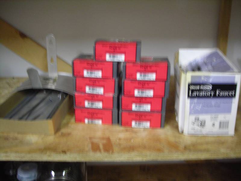 lot 36 image: 9 New Boxes Of Nails, Faucet, Other Assorted Hardware