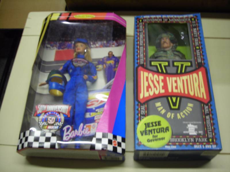 lot 43 image: Jesse Ventura & Nascar Barbie Dolls