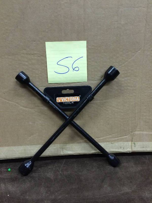 lot 56 image: 4 Way Lug Wrench New