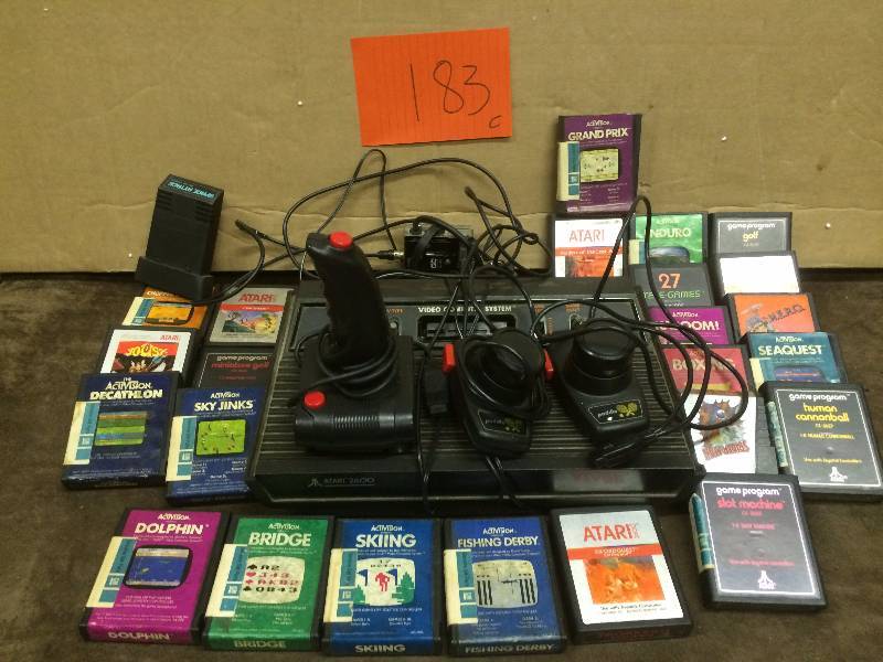 lot 183 image: Atari 2600 System with 24 games and controlers - used works