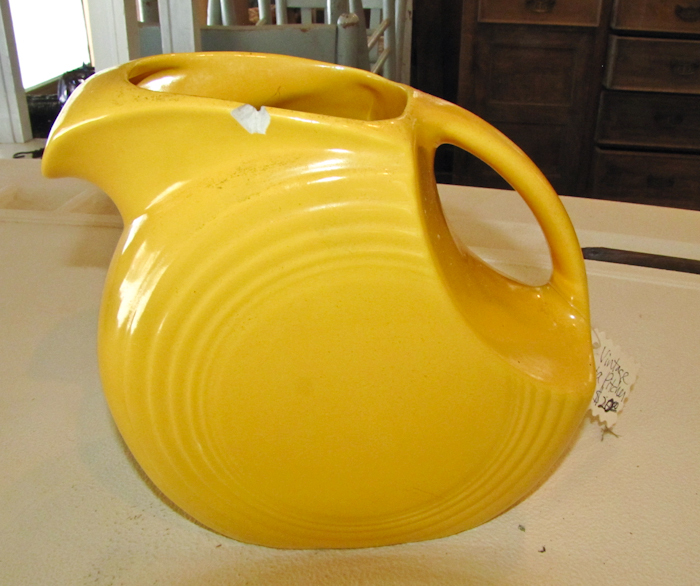 lot 98 image: Fiesta yellow pitcher with one chip see photos