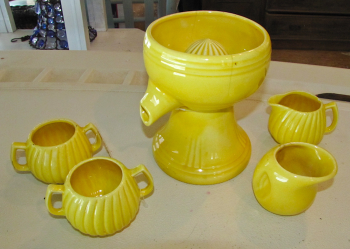 lot 101 image: Red Wing  Yellow Pedestal Juicer Reamer WSpout and Juice Glass, creamer and sugar