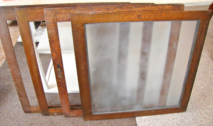 lot 111 image: four vintage sliding doors from a vintage retail display case